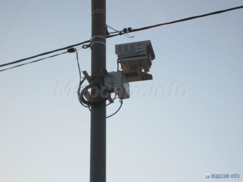 после выезда с заправки. двигаясь от моста.